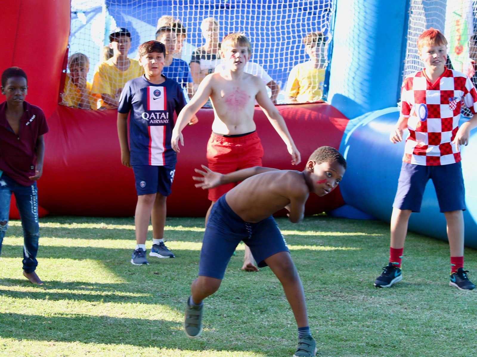 Kids playing inside the inflatable dodgeball arena